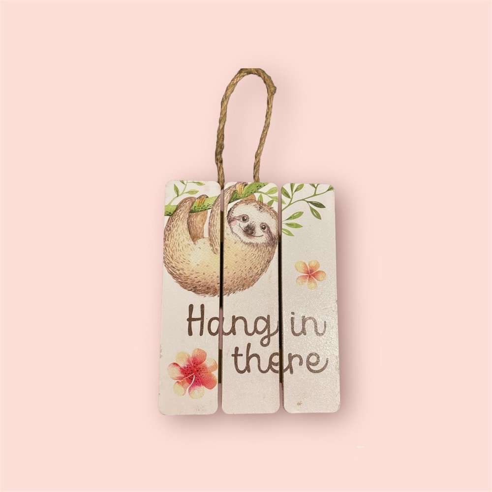 “Hang in there” wooden sloth sign
